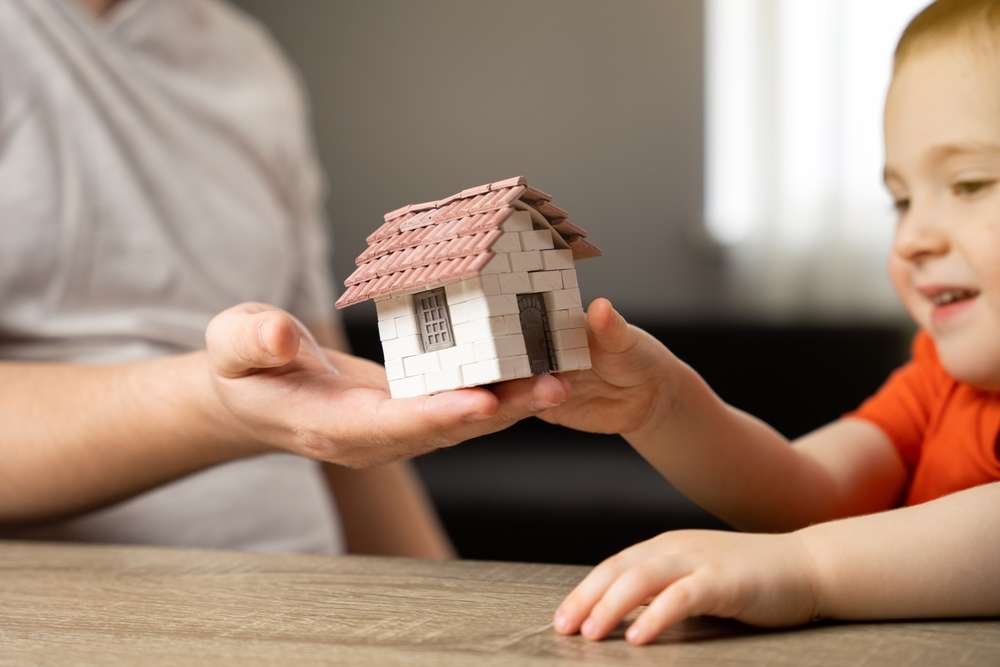Kid receiving small house