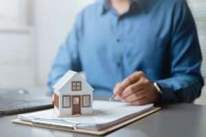 Businessman with house on contract