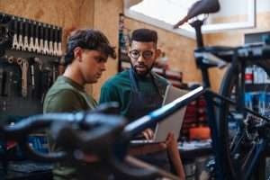 Two young bike mechanics