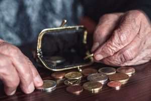 old person counting pennies